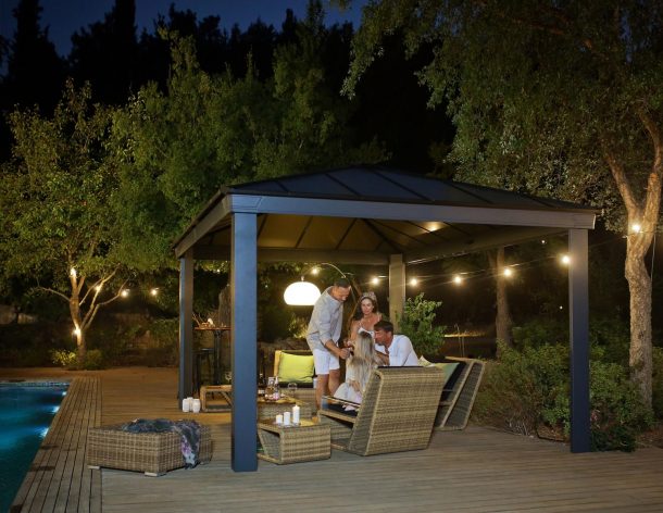 aluminium gazebo with lighting on a deck patio with dining furniture