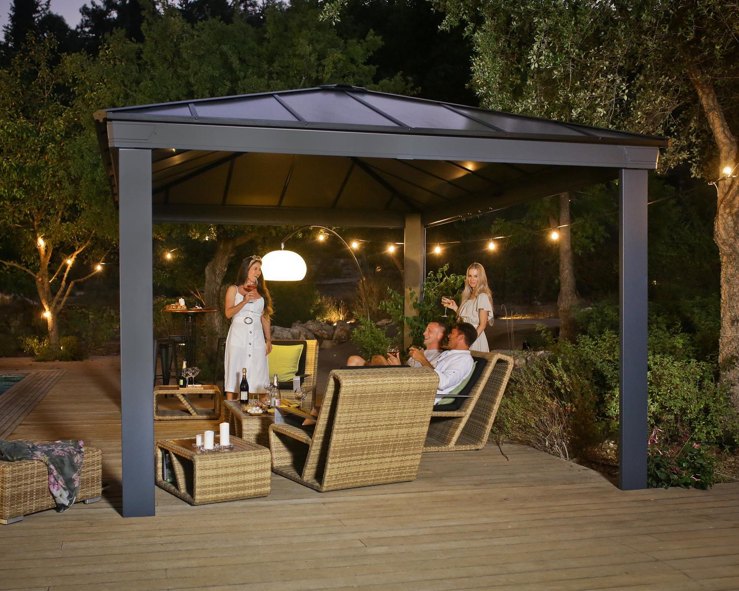 garden gazebo with lighting on a deck patio with garden furniture