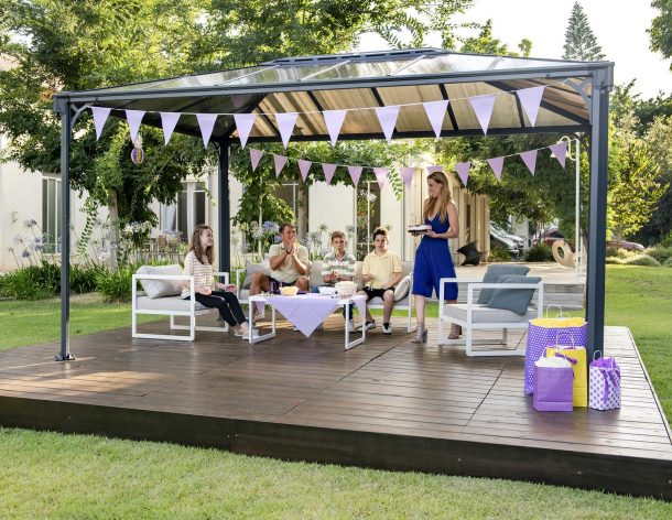 Family time on a deck patio under a 10'x14' aluminum gazebo with polycarbonate roof panels
