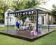 10'x14' aluminum gazebo with polycarbonate roof panels is used by a family for a birthday celebration on a deck patio