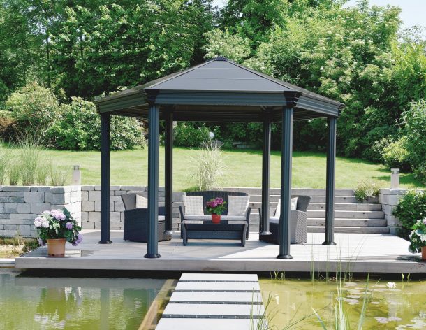 Hexagon gazebo on garden patio with garden furniture