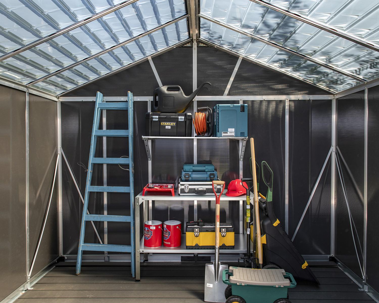 organizing of tools in a large storage shed with a skylight roof