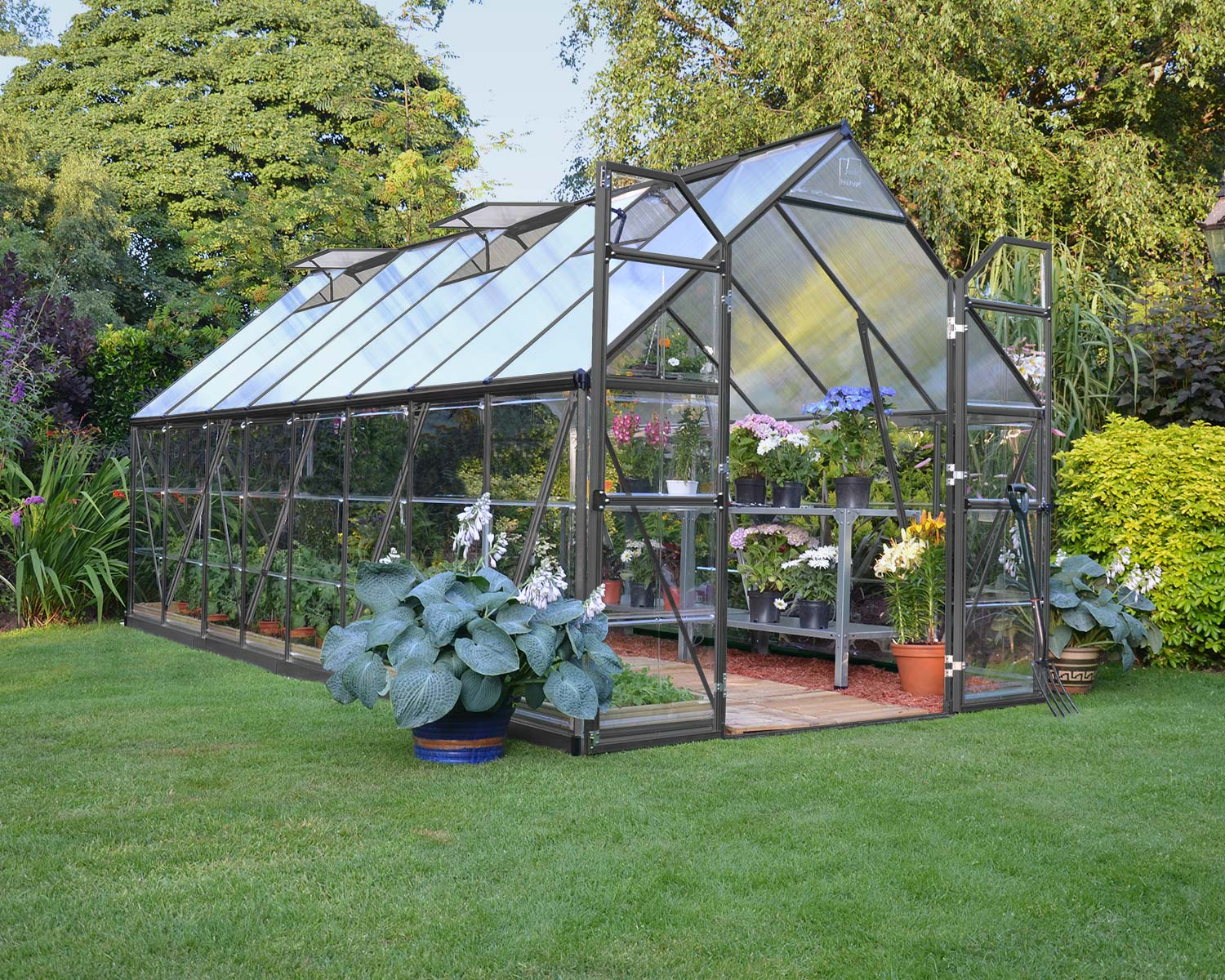 Balance 8' x 16' Greenhouse Grey Structure & Hybrid Panels open door on a lawn full of plants