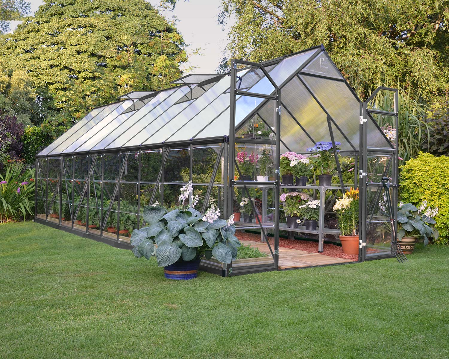 Greenhouse Balance 8 ft. x 20 ft. Grey Structure & Hybrid Panels open door on a lawn full of plants
