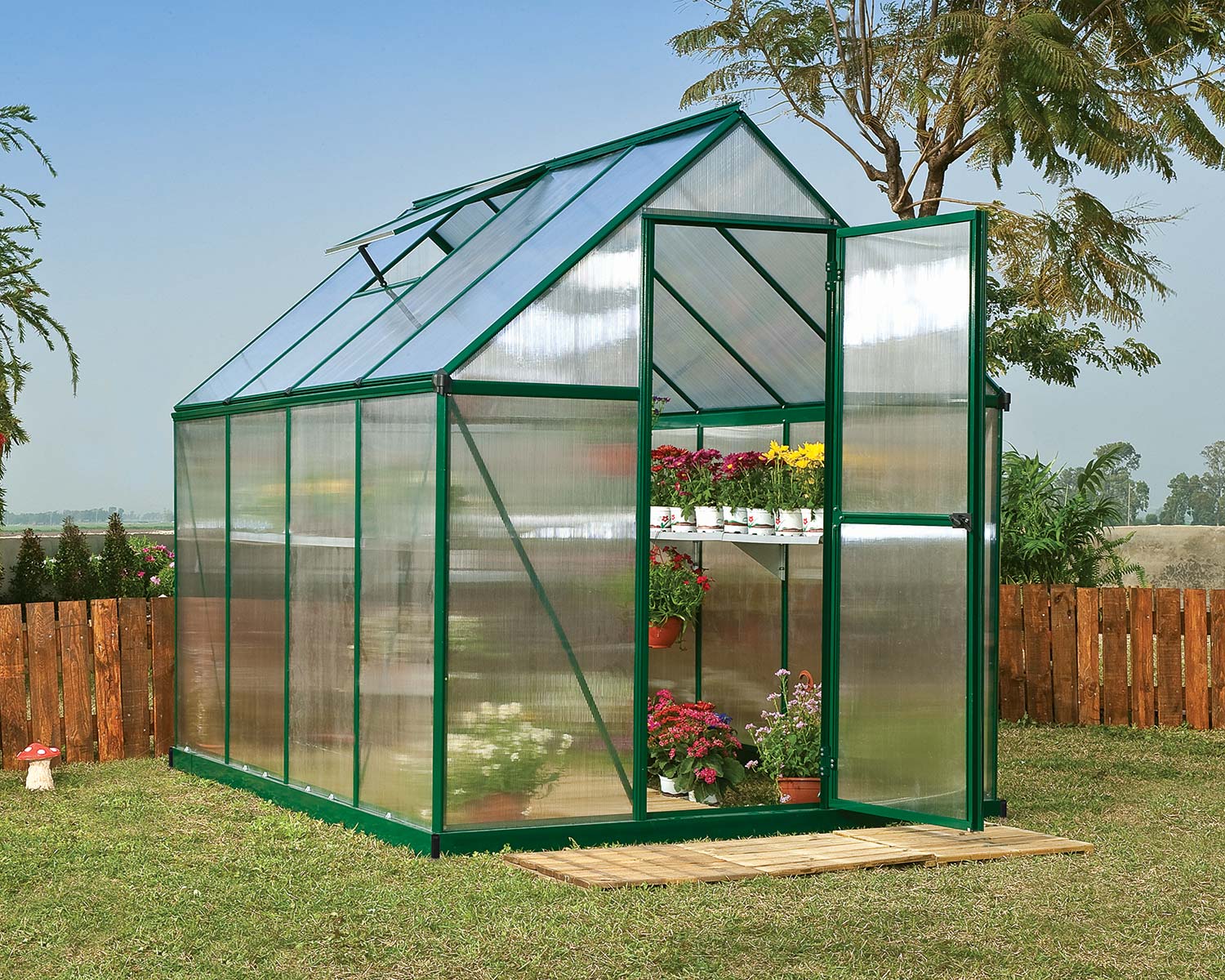 Mythos 6' x 8' Greenhouse Green Structure & Twinwall Panels outside on a lawn