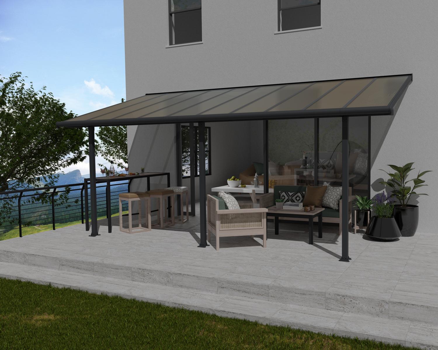 Grey Aluminium Patio Cover with Bronze-tinted twin-wall polycarbonate roof panels protect garden furniture