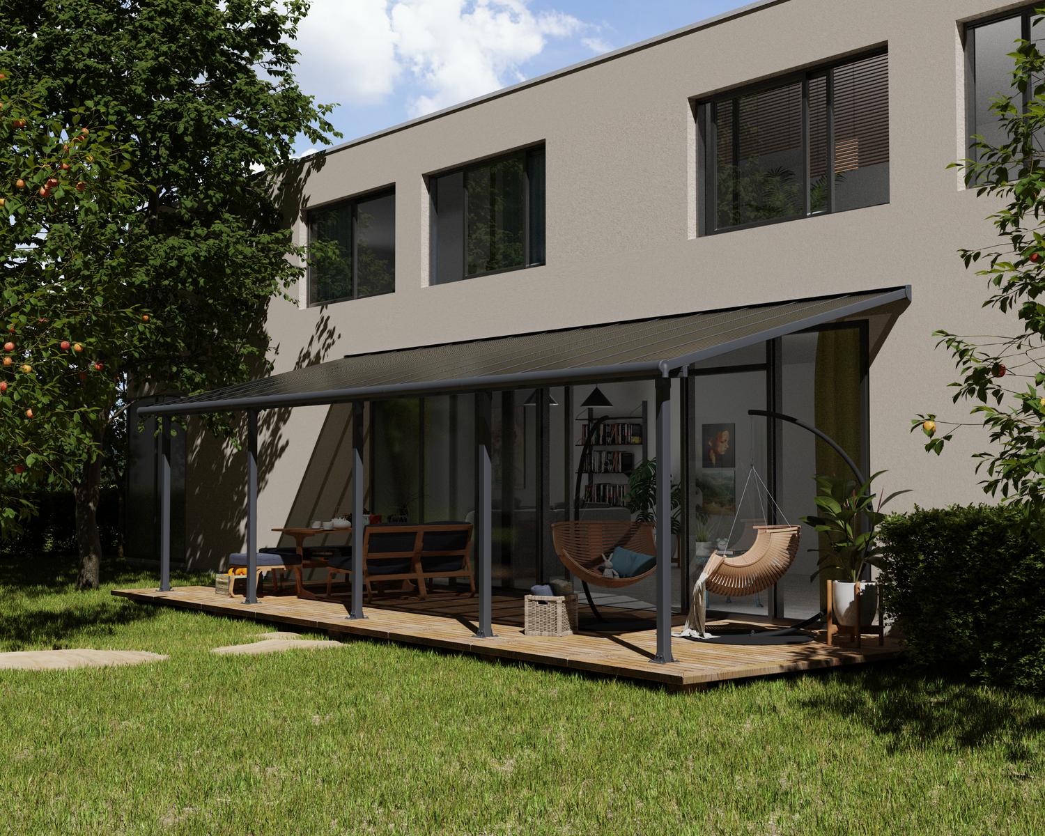 Grey Aluminium Patio Cover With Bronze-tinted twin-wall polycarbonate roof panels on Deck Patio protect garden furniture